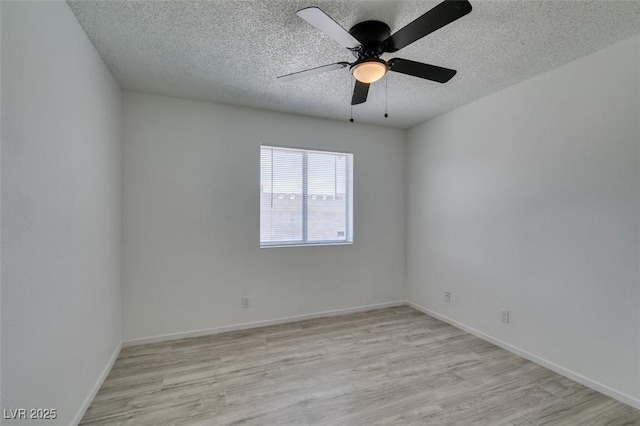 2116 Cameron St, Las Vegas, NV 89102 - spare room featuring light wood-style flooring, a textured ceiling, ceiling fan, and baseboards