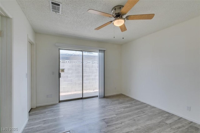 2116 Cameron St, Las Vegas, NV 89102 - spare room featuring wood finished floors, a ceiling fan, a textured ceiling, and baseboards