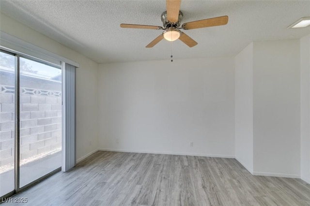 2116 Cameron St, Las Vegas, NV 89102 - spare room featuring wood finished floors, ceiling fan, baseboards, and a textured ceiling