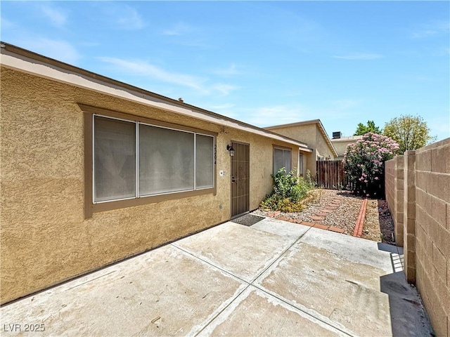 2204 Short Pine Dr, Las Vegas, NV 89108 - doorway to property featuring a patio and stucco siding