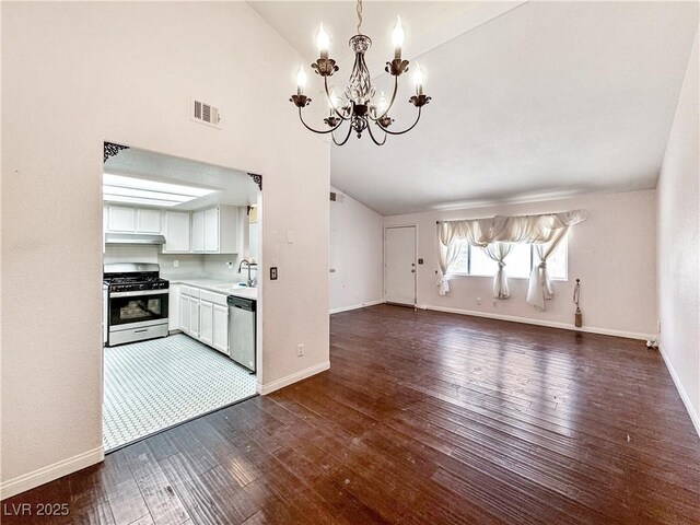 2204 Short Pine Dr, Las Vegas, NV 89108 - unfurnished living room with a chandelier, a sink, dark wood-style floors, lofted ceiling, and baseboards