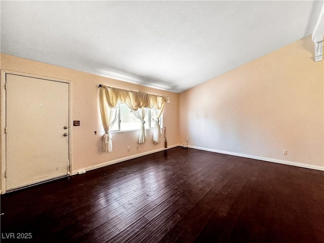 2204 Short Pine Dr, Las Vegas, NV 89108 - unfurnished living room with hardwood / wood-style floors and baseboards