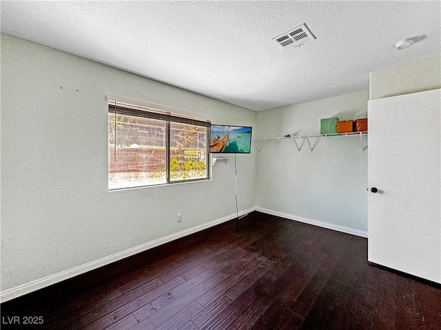 2204 Short Pine Dr, Las Vegas, NV 89108 - empty room featuring wood finished floors, baseboards, and a textured ceiling