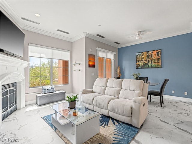 30 Via Vasari Unit 103, Henderson, NV 89011 - living area featuring marble finish floors, a glass covered fireplace, ceiling fan, baseboards, and crown molding