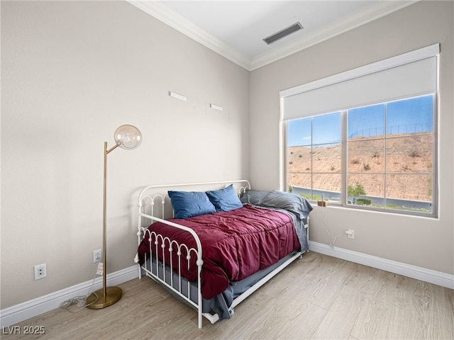 30 Via Vasari Unit 103, Henderson, NV 89011 - bedroom with wood finished floors, baseboards, and crown molding