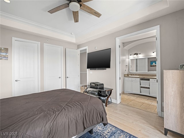 30 Via Vasari Unit 103, Henderson, NV 89011 - bedroom featuring crown molding, a sink, light wood-style flooring, connected bathroom, and ceiling fan