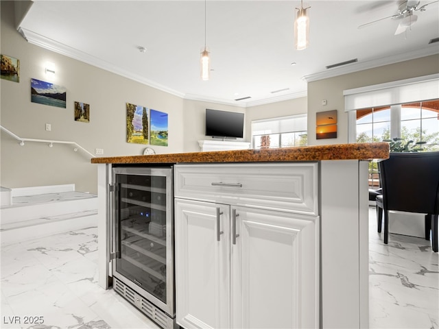 30 Via Vasari Unit 103, Henderson, NV 89011 - indoor bar featuring wine cooler, light marble finish flooring, ornamental molding, decorative light fixtures, and a ceiling fan