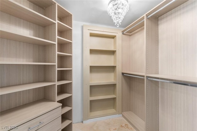 2777 Paradise Rd Unit 303, Las Vegas, NV 89109 - walk in closet featuring a chandelier
