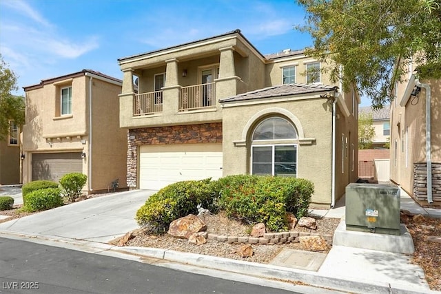 8015 Maple Park St, Las Vegas, NV 89131 - multi unit property featuring a balcony, stucco siding, a garage, and concrete driveway
