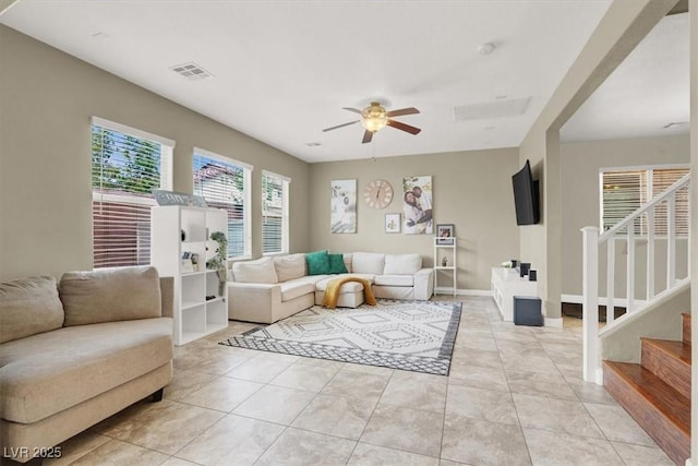8015 Maple Park St, Las Vegas, NV 89131 - living area with stairway, a ceiling fan, and light tile patterned floors
