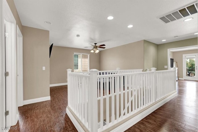 8015 Maple Park St, Las Vegas, NV 89131 - hall with healthy amount of natural light, baseboards, wood finished floors, recessed lighting, and an upstairs landing
