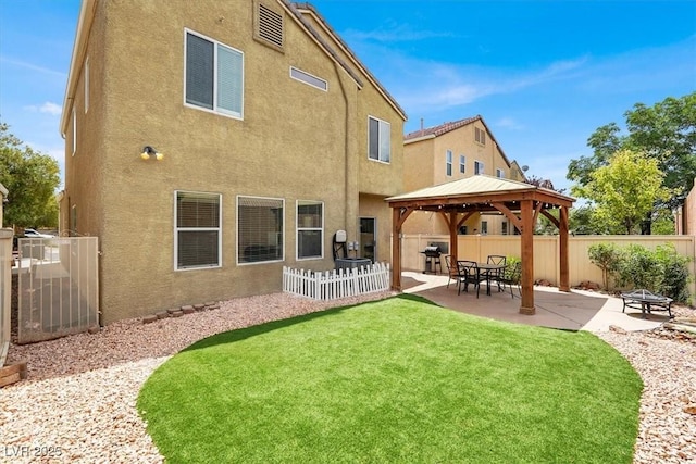8015 Maple Park St, Las Vegas, NV 89131 - rear view of property featuring a gazebo, stucco siding, and a patio