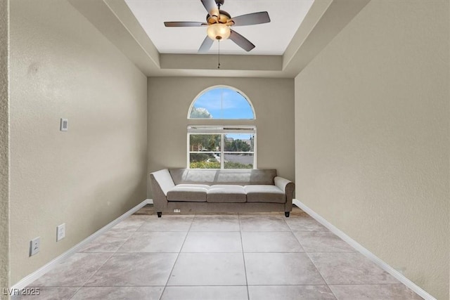 8015 Maple Park St, Las Vegas, NV 89131 - sitting room featuring a raised ceiling, ceiling fan, a textured wall, baseboards, and tile patterned flooring