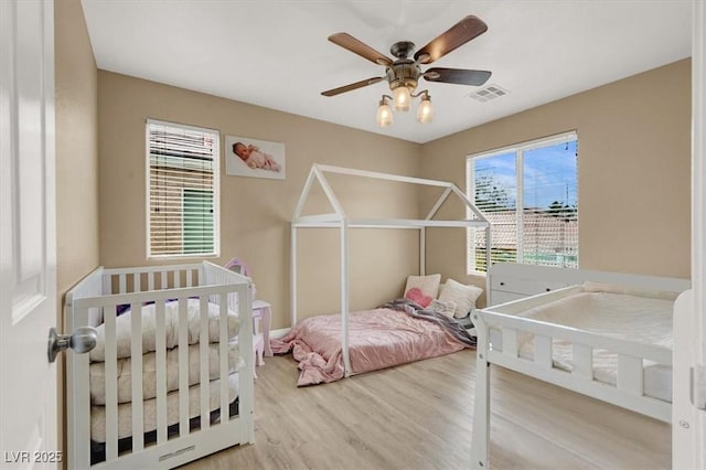 8015 Maple Park St, Las Vegas, NV 89131 - bedroom with wood finished floors and a ceiling fan