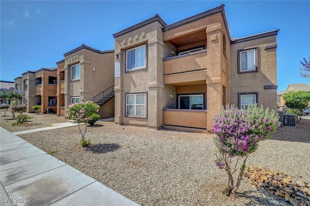 6650 W Warm Springs Rd Unit 1083, Las Vegas, NV 89118 - view of property featuring central AC and stairs