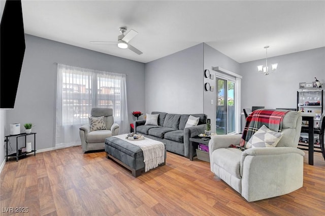 6650 W Warm Springs Rd Unit 1083, Las Vegas, NV 89118 - living room featuring a chandelier, wood finished floors, a ceiling fan, and baseboards