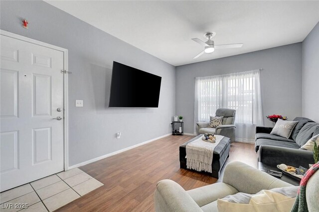 6650 W Warm Springs Rd Unit 1083, Las Vegas, NV 89118 - living area with wood finished floors, a ceiling fan, and baseboards