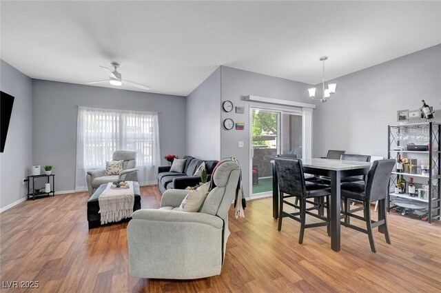6650 W Warm Springs Rd Unit 1083, Las Vegas, NV 89118 - dining area with a chandelier, wood finished floors, ceiling fan, and baseboards