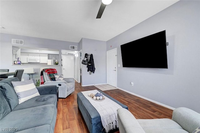 6650 W Warm Springs Rd Unit 1083, Las Vegas, NV 89118 - living room featuring a ceiling fan, baseboards, and wood finished floors