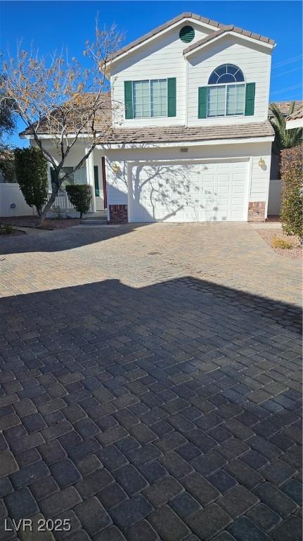 10337 Adams Chase St, Las Vegas, NV 89183 - view of front facade featuring an attached garage and driveway