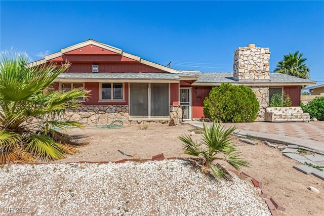 812 Pyramid Dr, Las Vegas, NV 89107 - view of front of property with a chimney and stone siding