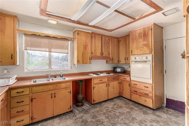 812 Pyramid Dr, Las Vegas, NV 89107 - kitchen with white appliances, a sink, light countertops, and light floors