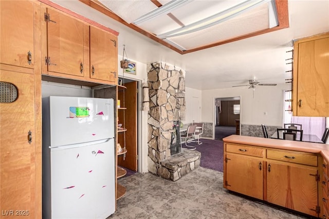 812 Pyramid Dr, Las Vegas, NV 89107 - kitchen with freestanding refrigerator, ceiling fan, light countertops, and light carpet