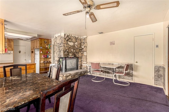 812 Pyramid Dr, Las Vegas, NV 89107 - dining area with a ceiling fan, carpet, and a fireplace