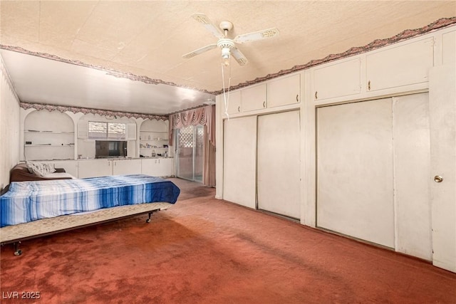 812 Pyramid Dr, Las Vegas, NV 89107 - bedroom featuring light colored carpet, two closets, and a ceiling fan