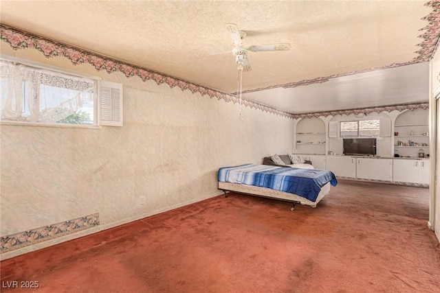812 Pyramid Dr, Las Vegas, NV 89107 - carpeted bedroom with ceiling fan and a textured ceiling