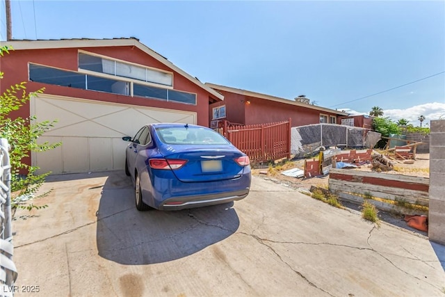 812 Pyramid Dr, Las Vegas, NV 89107 - view of front facade featuring stucco siding and concrete driveway