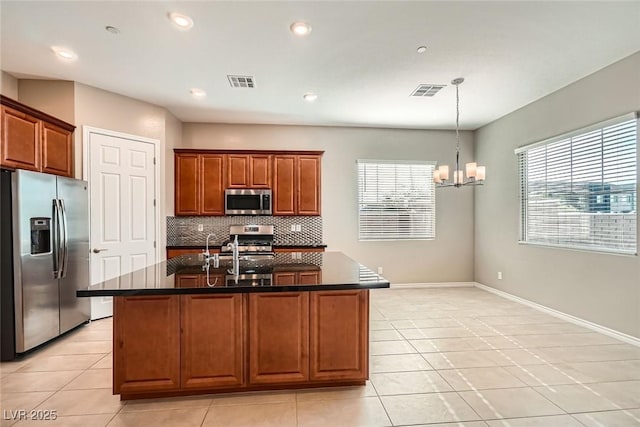 208 Coltrane Canyon Ave, Henderson, NV 89011 - kitchen featuring stainless steel appliances, tasteful backsplash, light tile patterned floors, a chandelier, and recessed lighting