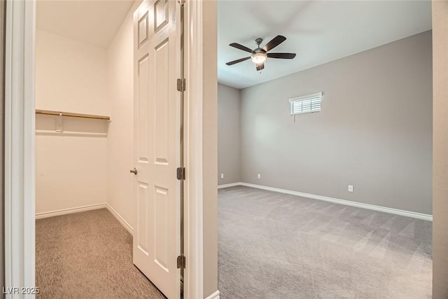 208 Coltrane Canyon Ave, Henderson, NV 89011 - unfurnished bedroom with carpet, baseboards, a spacious closet, ceiling fan, and a closet