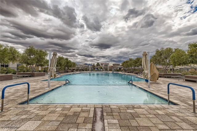 208 Coltrane Canyon Ave, Henderson, NV 89011 - community pool with a patio area
