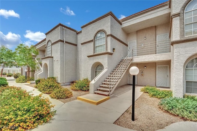 3150 Soft Breezes Dr Unit 1040, Las Vegas, NV 89128 - view of front of house with stucco siding and stairway