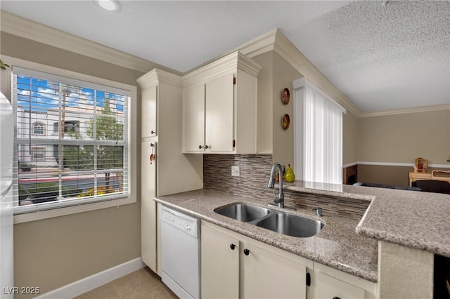 3150 Soft Breezes Dr Unit 1040, Las Vegas, NV 89128 - kitchen with dishwasher, a sink, baseboards, backsplash, and white cabinetry