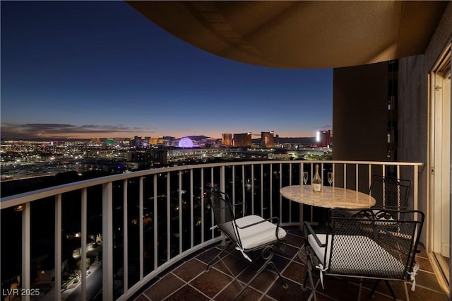 3111 Bel Air Dr Unit 20H, Las Vegas, NV 89109 - balcony at dusk featuring a view of city