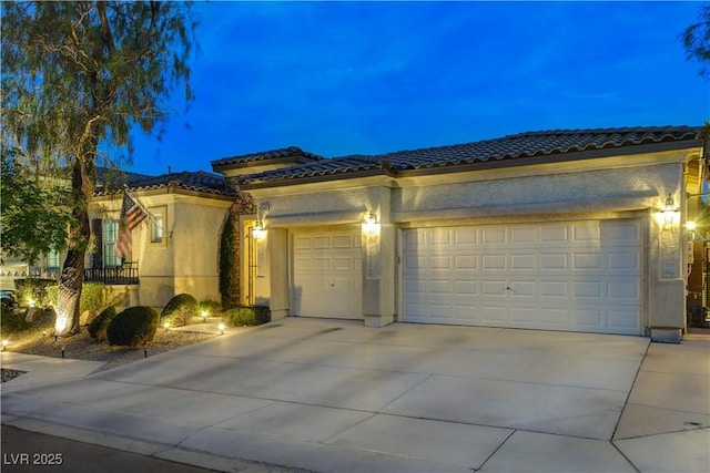 9349 Olympia Falls Ave, Las Vegas, NV 89149 - mediterranean / spanish home featuring a tiled roof, driveway, stucco siding, and a garage