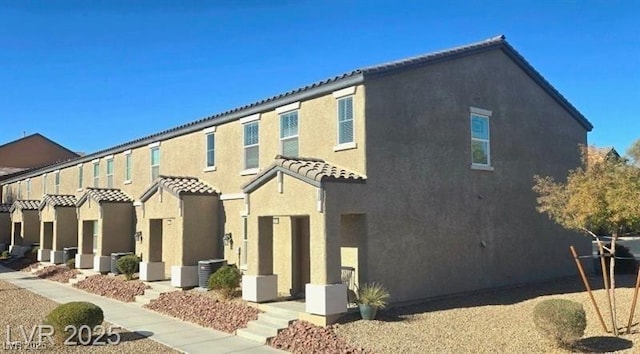 5209 Silica Chalk Ave, Las Vegas, NV 89115 - view of front facade with a tile roof and stucco siding