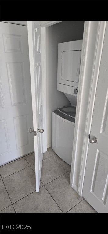 5209 Silica Chalk Ave, Las Vegas, NV 89115 - washroom featuring stacked washer / dryer and light tile patterned flooring