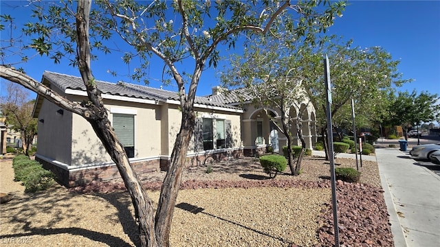 5209 Silica Chalk Ave, Las Vegas, NV 89115 - view of property exterior featuring a tile roof and stucco siding