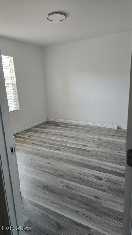 5209 Silica Chalk Ave, Las Vegas, NV 89115 - unfurnished room with wood finished floors and baseboards