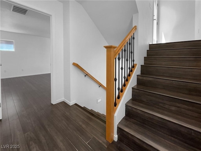 9384 Hosner St, Las Vegas, NV 89178 - staircase featuring wood finished floors, baseboards, and vaulted ceiling