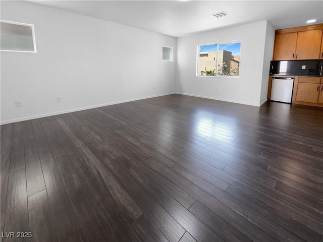 9384 Hosner St, Las Vegas, NV 89178 - unfurnished living room featuring dark wood-style floors and baseboards