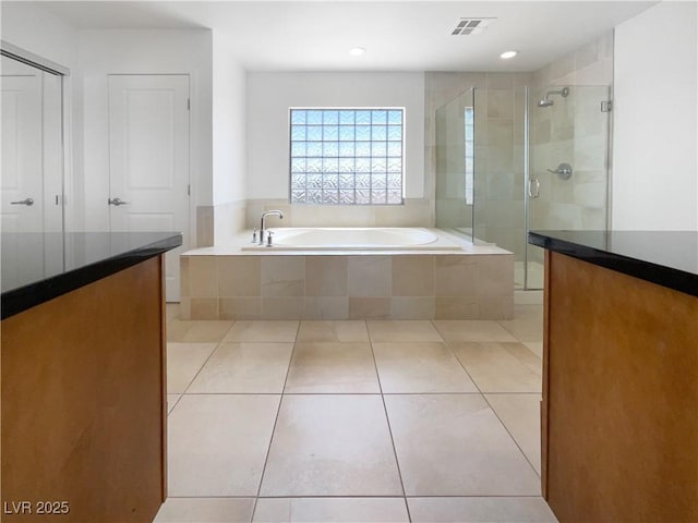 9384 Hosner St, Las Vegas, NV 89178 - bathroom with a bath, a shower stall, tile patterned floors, recessed lighting, and vanity