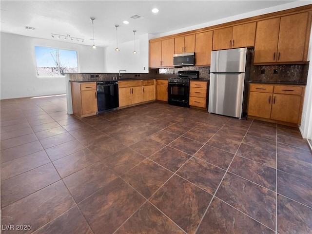 9384 Hosner St, Las Vegas, NV 89178 - kitchen with black appliances, dark countertops, decorative backsplash, a peninsula, and recessed lighting