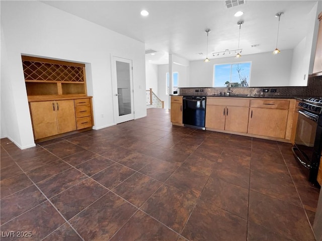 9384 Hosner St, Las Vegas, NV 89178 - kitchen featuring black appliances, decorative backsplash, pendant lighting, dark countertops, and a peninsula