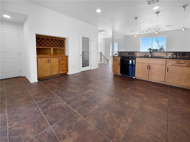 9384 Hosner St, Las Vegas, NV 89178 - kitchen featuring black dishwasher, a sink, dark countertops, tasteful backsplash, and decorative light fixtures