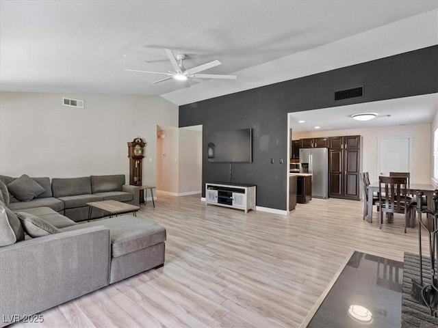 6436 Vinecrest Ave, Las Vegas, NV 89108 - living room with lofted ceiling, light wood-style floors, and ceiling fan