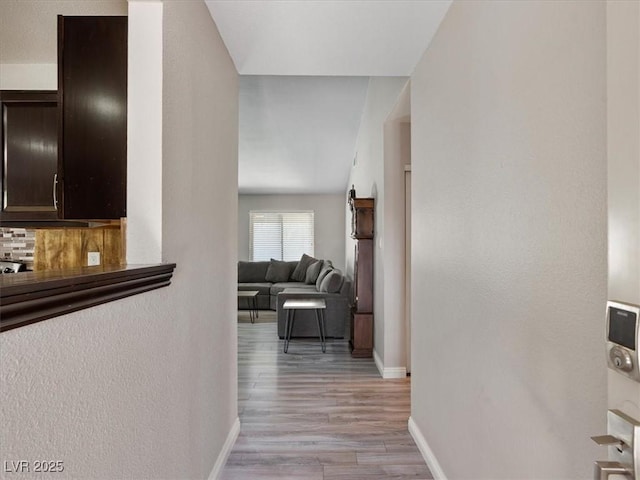 6436 Vinecrest Ave, Las Vegas, NV 89108 - corridor with light wood-style floors and a textured wall
